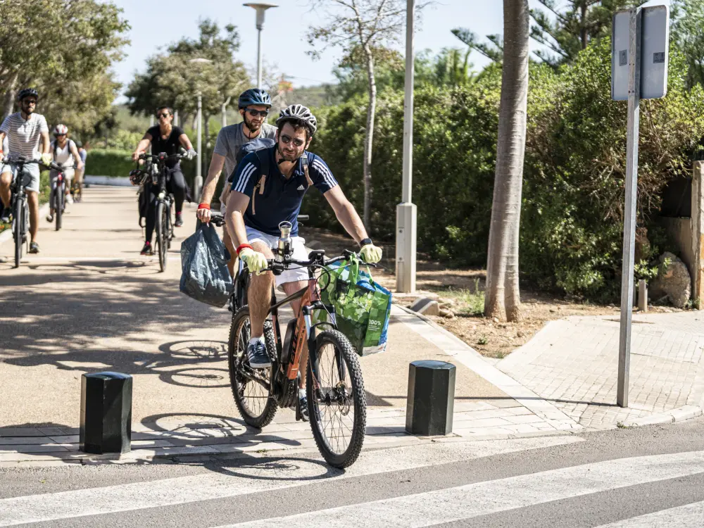 Biking and collecting trash Mallorca